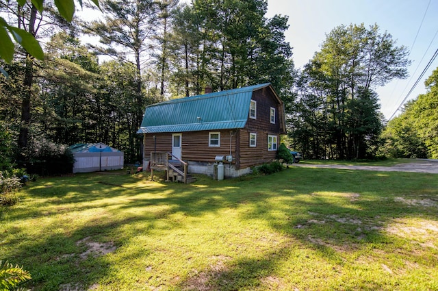 view of side of home featuring a lawn