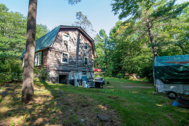 view of home's exterior with a lawn