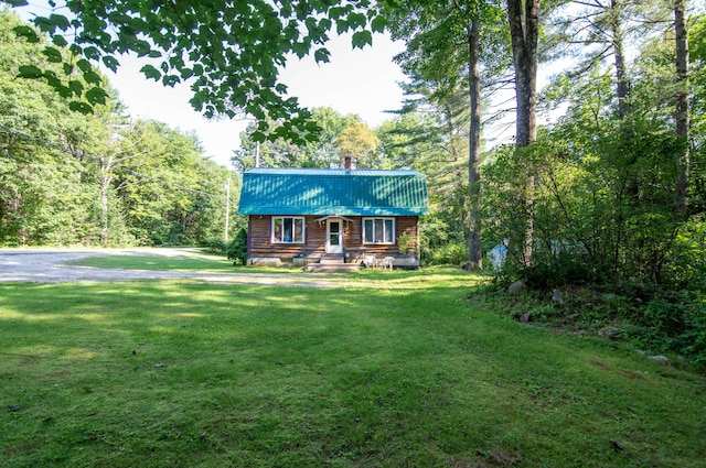 log-style house with a front lawn