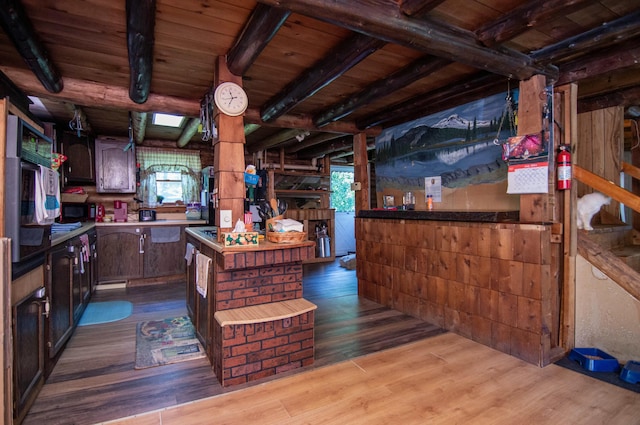 kitchen with dark brown cabinets, light hardwood / wood-style flooring, wooden ceiling, and beamed ceiling