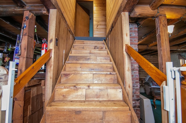 stairs with wood walls