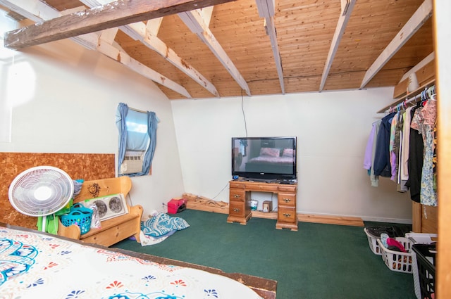 bedroom featuring lofted ceiling with beams, wooden ceiling, and carpet flooring