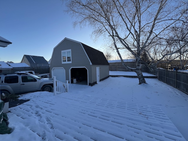 exterior space with a garage and an outdoor structure