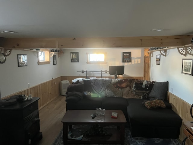 living room featuring wood-type flooring and wood walls