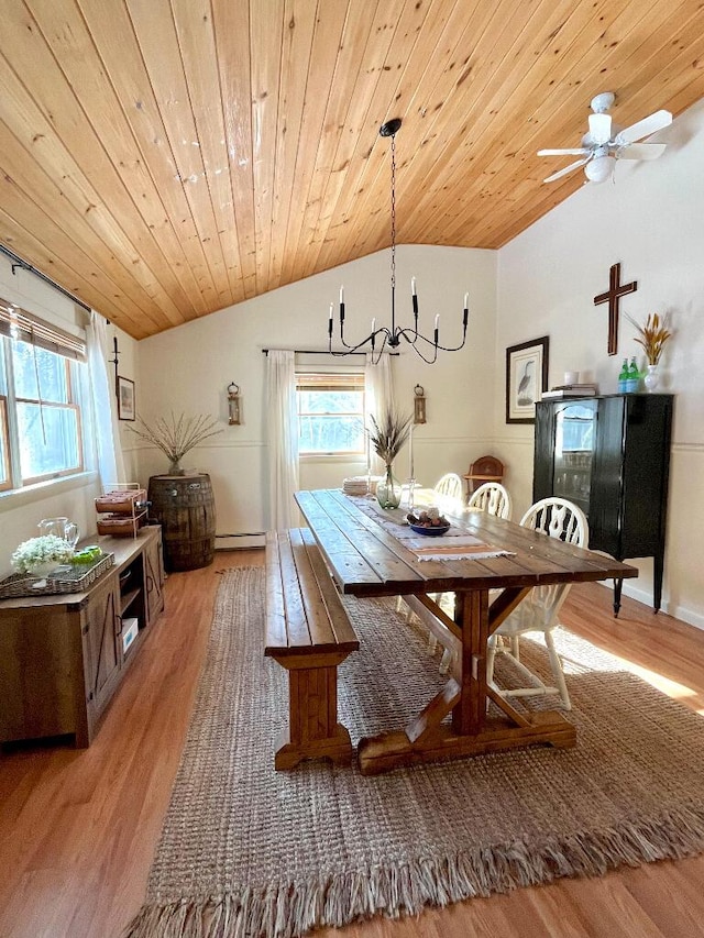 dining room with wooden ceiling, plenty of natural light, vaulted ceiling, and light wood-type flooring