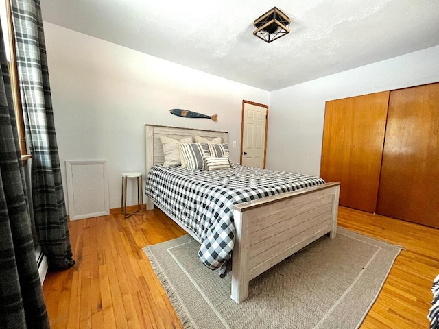 bedroom featuring light hardwood / wood-style floors and a closet