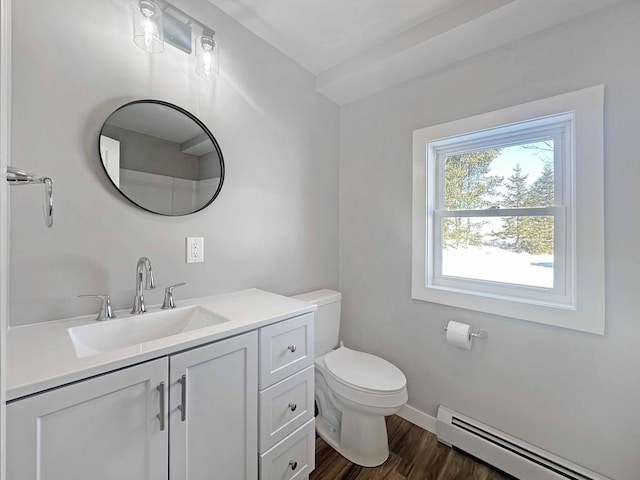 bathroom featuring a baseboard radiator, vanity, toilet, and wood-type flooring