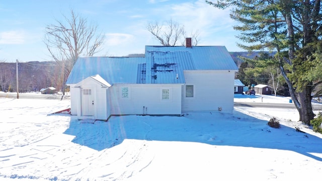 view of snow covered house