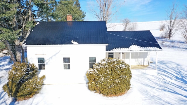 view of snow covered property