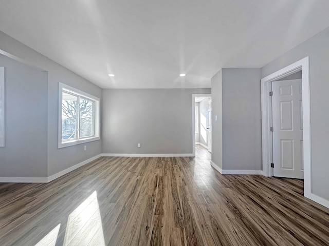 spare room with hardwood / wood-style flooring