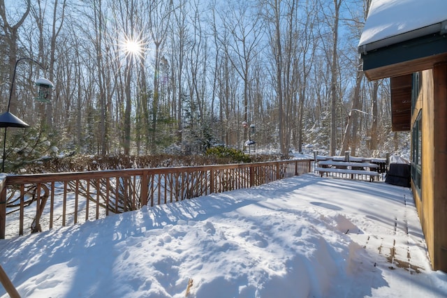 view of snow covered deck