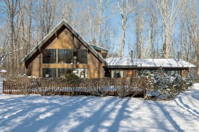 view of snow covered house