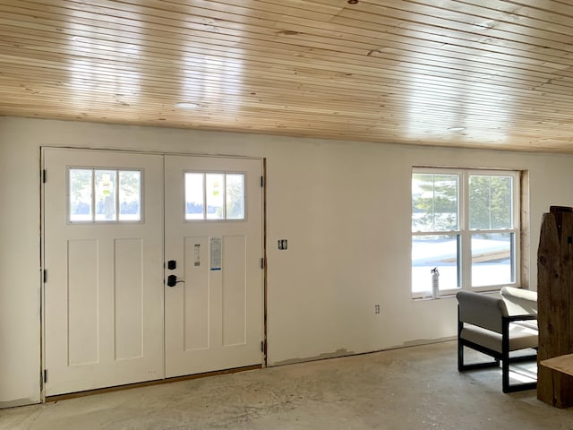 foyer with a wealth of natural light and wooden ceiling