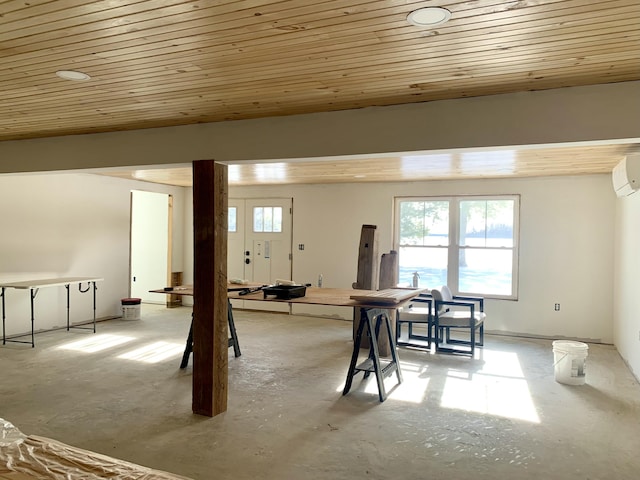 basement featuring a wall mounted AC and wooden ceiling