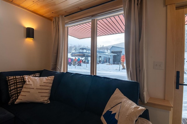 bedroom with access to exterior and wooden ceiling