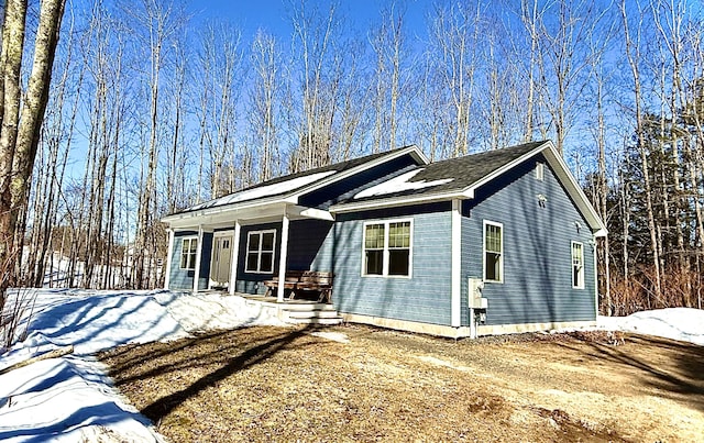 ranch-style home featuring covered porch