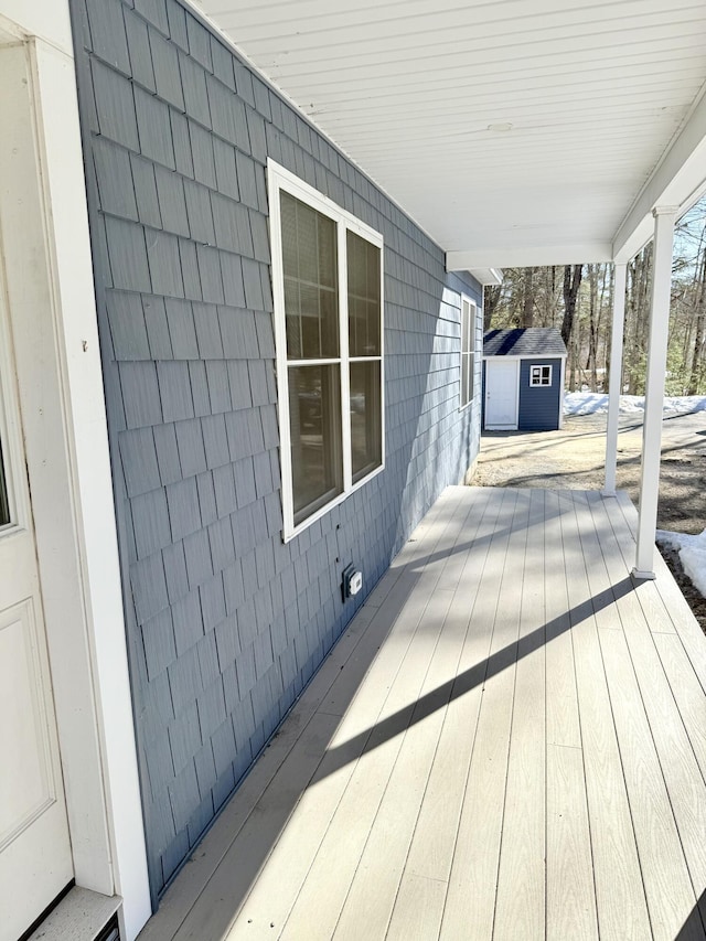 deck with an outdoor structure