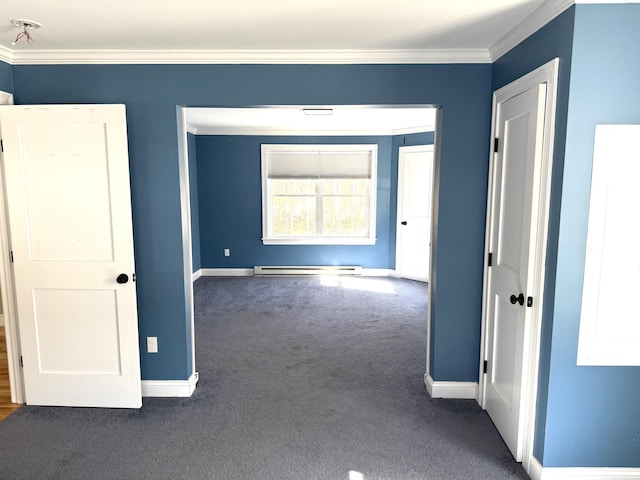 carpeted spare room with ornamental molding, a baseboard radiator, and baseboards