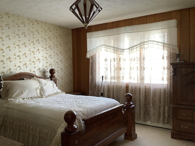 bedroom featuring light carpet