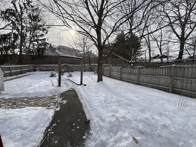 view of yard covered in snow