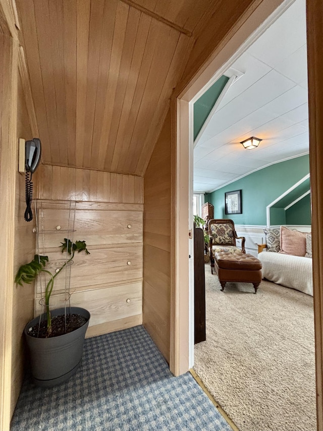 bathroom with wooden walls, vaulted ceiling, and wooden ceiling