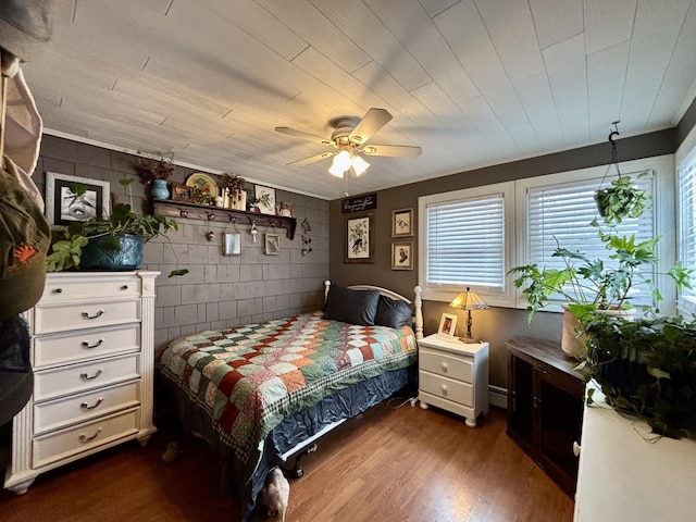 bedroom featuring hardwood / wood-style flooring and ceiling fan