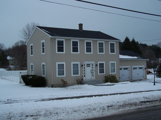 colonial house featuring a garage