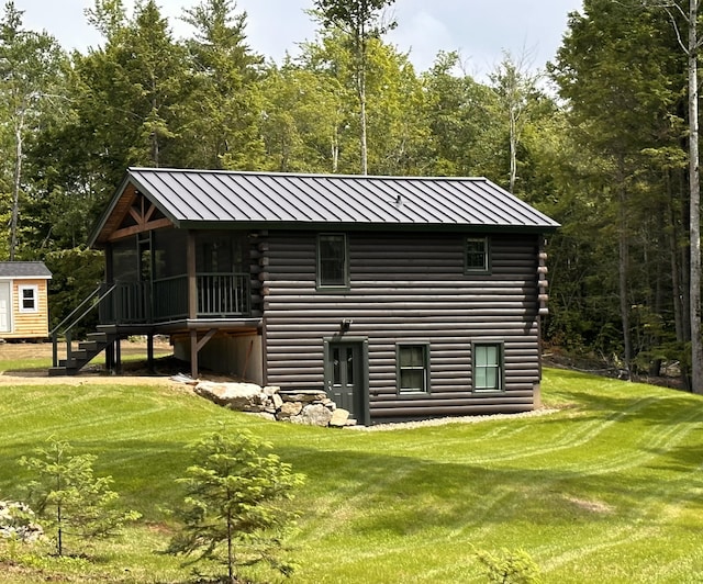 view of outbuilding featuring stairway