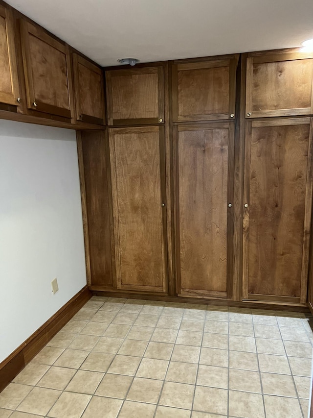 kitchen with light tile patterned floors