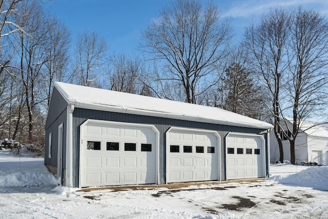 view of snow covered garage