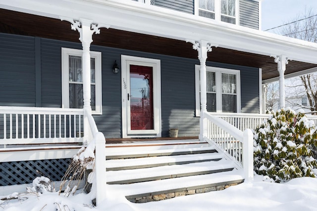 view of snow covered property entrance