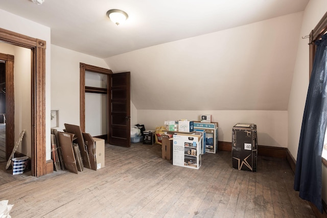 office featuring hardwood / wood-style floors and vaulted ceiling