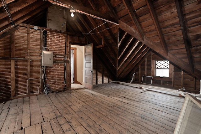 unfinished attic with electric panel