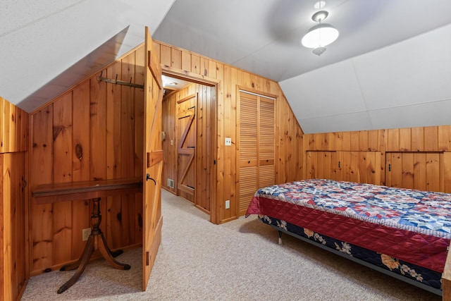 bedroom featuring lofted ceiling, light carpet, and wood walls