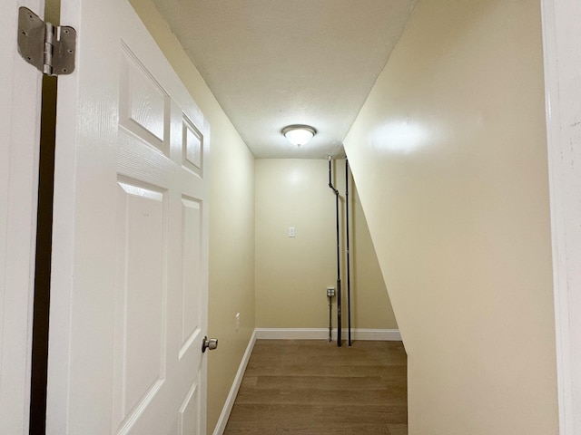 corridor with wood-type flooring