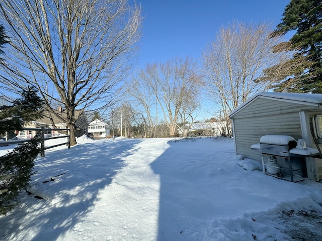 view of yard layered in snow