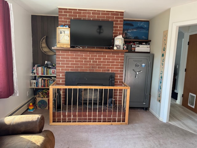 carpeted living area with baseboards, a large fireplace, and baseboard heating