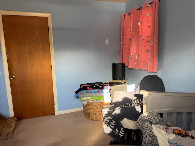 bedroom featuring carpet flooring and baseboards