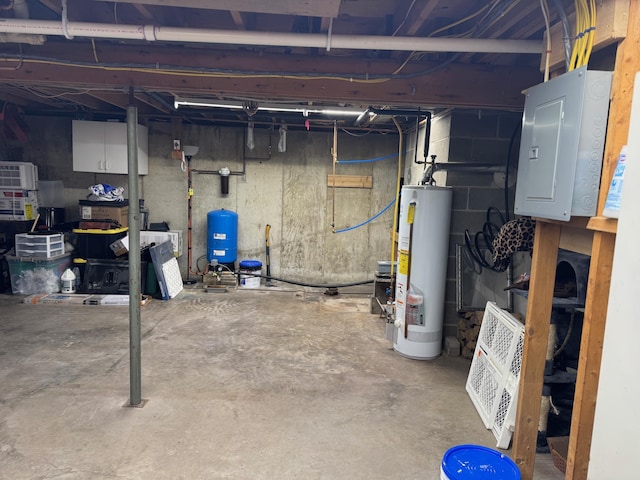 unfinished below grade area with electric panel and water heater