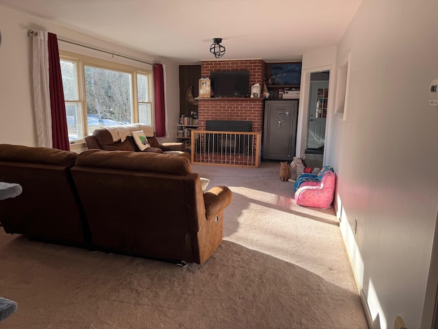 living room with a fireplace and carpet