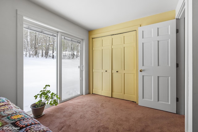 16 Hanna Ln, Bristol, ME 04539 - bedroom with light colored carpet, a closet, and access to exterior