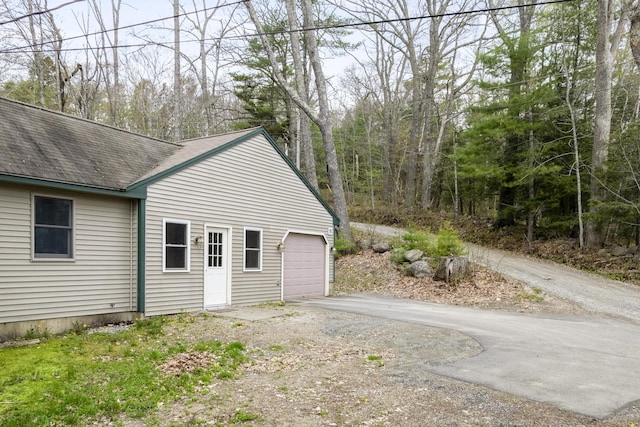 16 Hanna Ln, Bristol, ME 04539 - garage featuring asphalt driveway