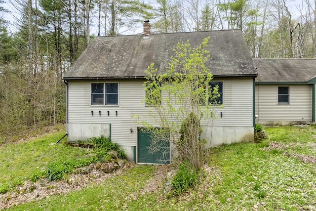 16 Hanna Ln, Bristol, ME 04539 - rear view of house with a chimney, a yard, and roof with shingles
