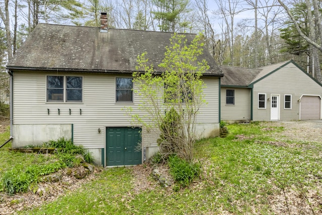 16 Hanna Ln, Bristol, ME 04539 - back of house with a chimney, roof with shingles, and a lawn