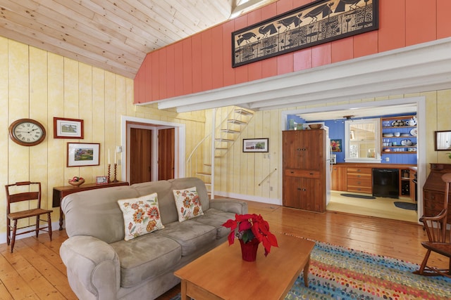 living room with wood ceiling, high vaulted ceiling, and light wood-type flooring