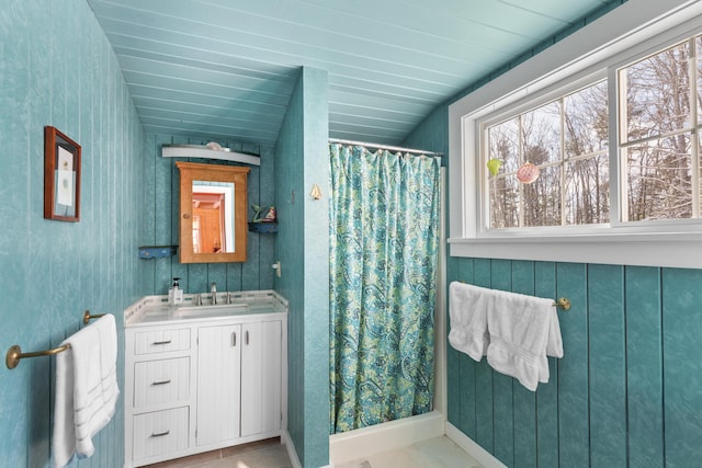 bathroom with vanity and curtained shower