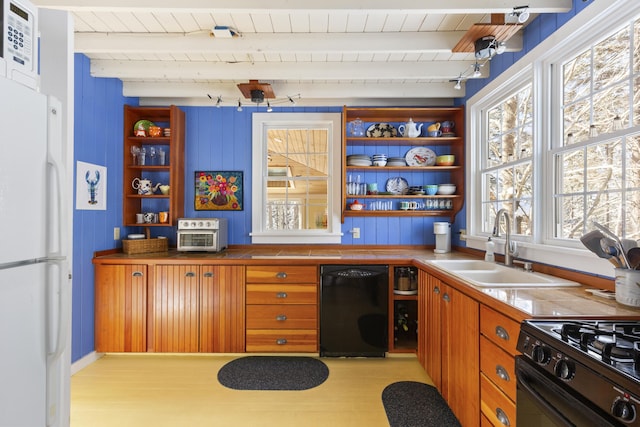 kitchen featuring sink, wood ceiling, beam ceiling, black appliances, and light wood-type flooring