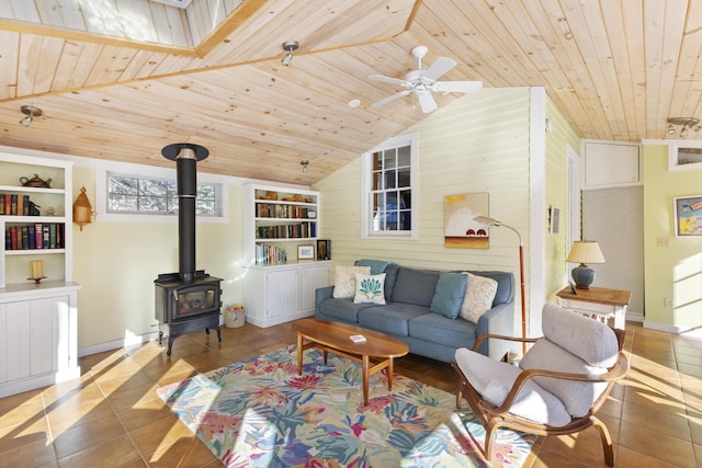 living room with built in features, wooden ceiling, vaulted ceiling, tile patterned floors, and a wood stove