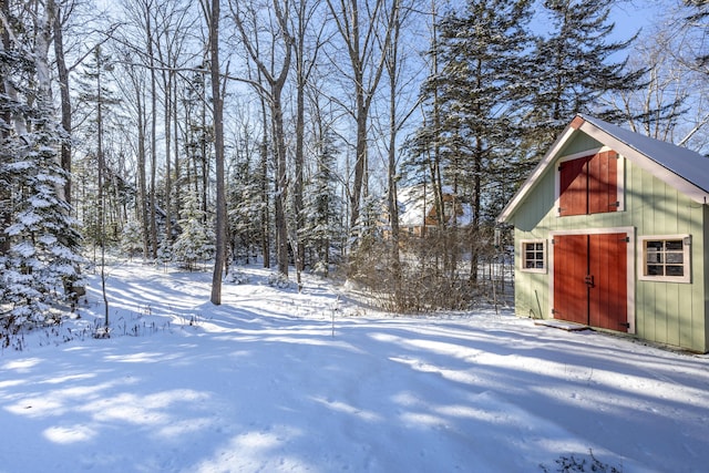 snowy yard with an outdoor structure