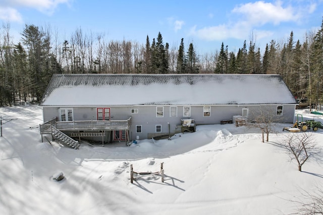 view of snow covered house